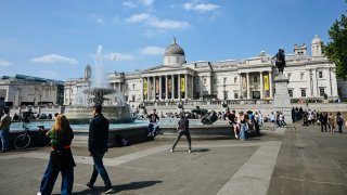 People walk in Trafalgar Square, London, on April 28, 2025.