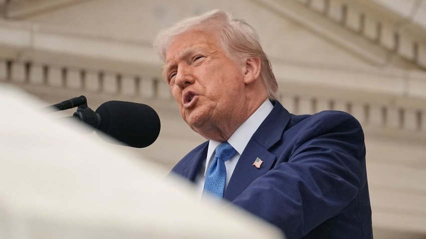 U.S. President Donald Trump gestures at the annual National Memorial Day Observance in the Memorial Amphitheater, at Arlington National Cemetery in Arlington, Virginia, U.S., May 26, 2025.