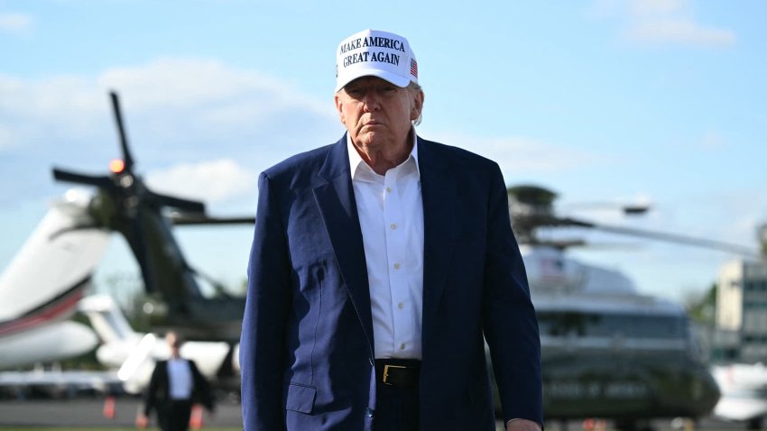 US President Donald Trump walks to speak to journalists before boarding Air Force One from Morristown Municipal Airport in Morristown, New Jersey, May 25, 2025.