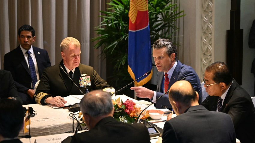 US Secretary of Defense Pete Hegseth (C) gestures beside Malaysia’s Defence Minister Mohamed Khaled Nordin (R) and other defence officials from the Association of Southeast Asian Nations (ASEAN) during a multilateral meeting ahead of the Shangri-La Dialogue Summit in Singapore on May 30, 2025.