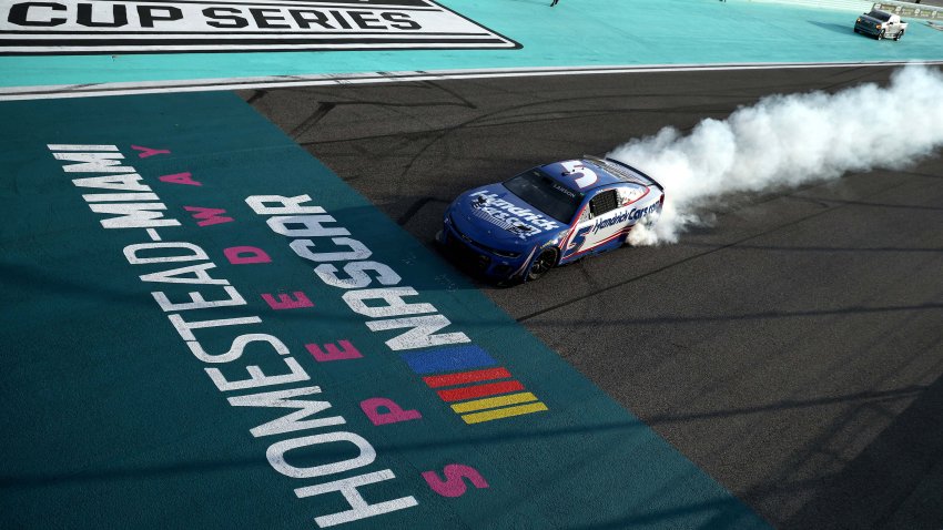 Kyle Larson celebrates with a burnout
