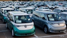 Rows of Volkswagen ID Buzz electric vans parked at a vehicle processing lot at the National City Marine Terminal in National City, California, on April 26, 2025.