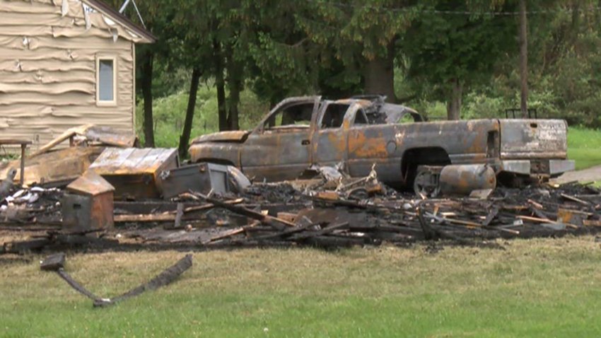 Burned truck and rubble