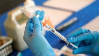 FILE – A nurse prepares a syringe of a COVID-19 vaccine at an inoculation station in Jackson, Miss., July 19, 2022. U.S. health officials are proposing a simplified approach to COVID-19 vaccinations, which would allow most adults and children to get a once-a-year shot to protect against the mutating virus. The new system unveiled Monday, Jan. 23, 2023 would make COVID-19 inoculations more like the annual flu shot. Americans would no longer have to keep track of how many shots they’ve received or how many months it’s been since their last booster.