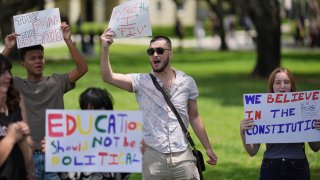 A group of Florida International University students protest against cuts in federal funding