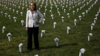 Former congresswoman and gun violence survivor Gabby Giffords walks through the Gun Violence Memorial in front of the Washington Monument on June 7, 2022, in Washington, D.C.