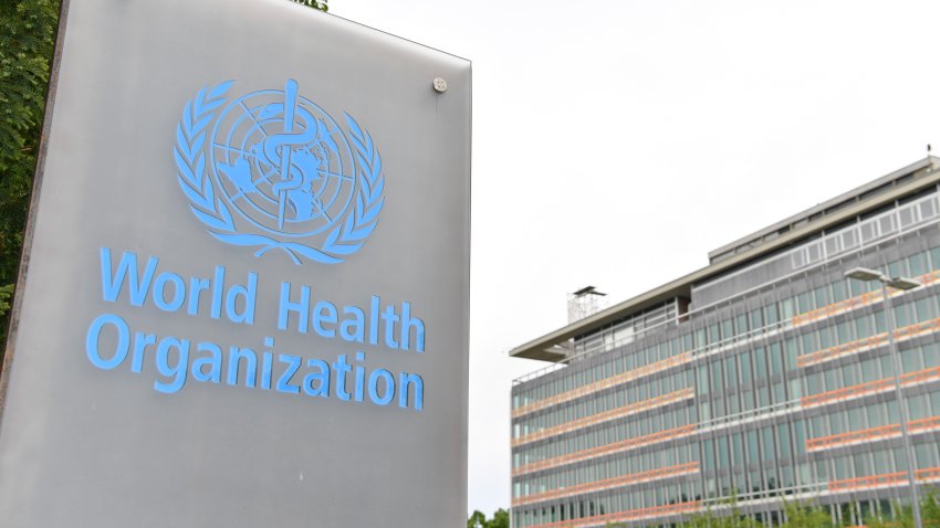 This photo taken on May 21, 2023 shows a logo of the World Health Organization WHO with the WHO headquarters in the background in Geneva, Switzerland.