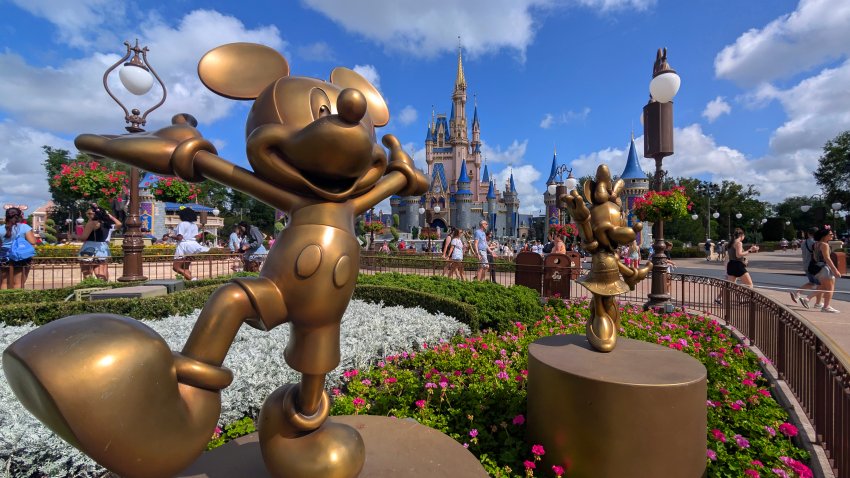 ORLANDO, FL – APRIL 3: Statues of Mickey Mouse and Minnie Mouse stand in a garden in front of Cinderella’s Castle at the Magic Kingdom Park at Walt Disney World on April 3, 2025, in Orlando, Florida. (Photo by Gary Hershorn/Getty Images)