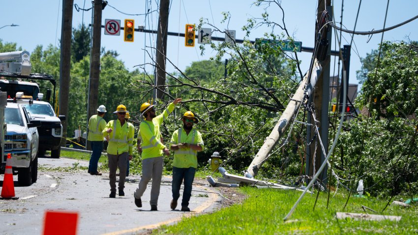 Some residents are without power and streets are closed in part of Alexandria, VA on Saturday, May 17, 2025 following a storm on Friday. Contracters work to replace broken electrical poles on Van Dorn Street between Holmes Run Pkwy and Landmark St.  (Photo by Sarah L. Voisin/The Washington Post via Getty Images)