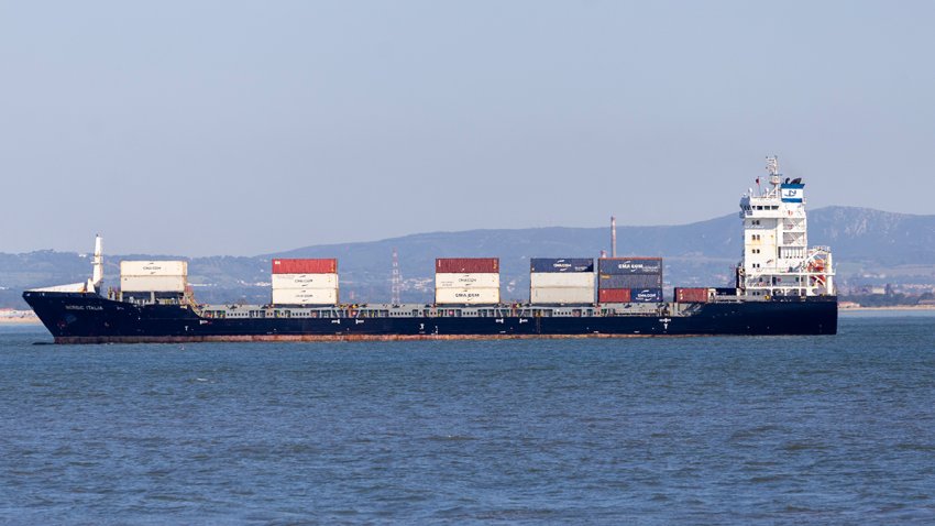 A cargo ship loaded with containers sails near the coast of Portugal on May 24, 2025.
