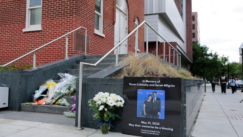 A tribute and flowers for Israeli Embassy staff members Yaron Lischinsky and Sarah Lynn Milgrim are seen outside the Lillian and Albert Small Capital Jewish Museum on May 23, 2025 in Washington, DC.