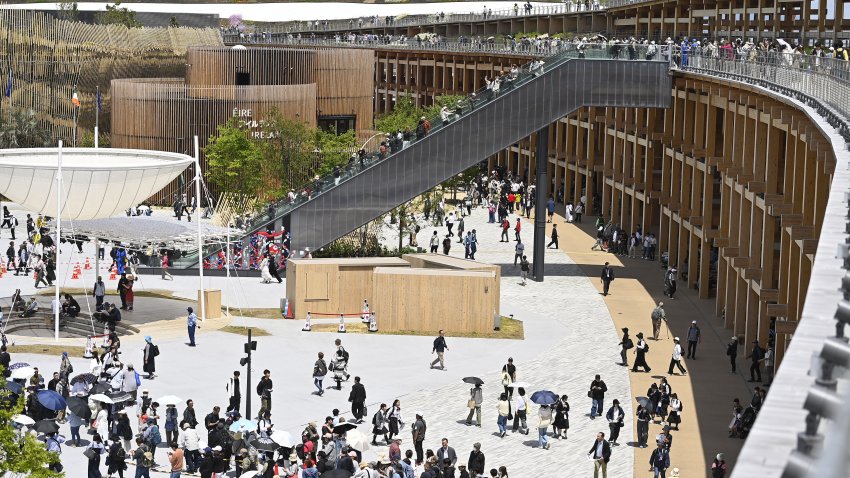 Visitors are seen using an escalator to access the immense wooden structure called the Great Ring on the May 7, 2025, in Osaka, Japan, as they attend the World Exposition Osaka 2025. The Great Ring is the symbol of Expo 2025 Osaka, expressing the concept of ‘Unity in Diversity.’ Its construction uses a fusion of modern and traditional building methods used in the construction of Japanese shrines and temples, a technique called Nuki. Built on Yumeshima, an artificial island in Osaka Bay, with a circumference of 2 kilometers (1.2 miles) and the immense wooden structure is recognized by the Guinness World Records as the world’s largest wooden architectural structure.