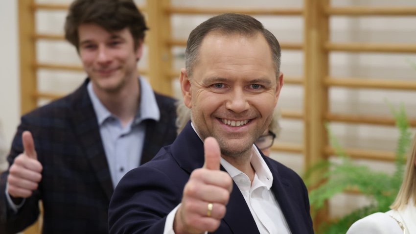 WARSAW, POLAND – JUNE 01: Karol Nawrocki, presidential candidate of the Law and Justice Party (PiS), gestures as he arrives with his family to cast his ballot at a polling station during the Polish presidential runoff election on June 01, 2025 in Warsaw, Poland. Today’s election is a closely contested race between Nawrocki and Rafal Trzaskowski, the liberal mayor of Warsaw who is supported by Prime Minister Donald Tusk. The election is seen as a test of whether the government, with its centrist parliamentary coalition, can overcome the right-wing populism embodied by PiS. (Photo by Sean Gallup/Getty Images)