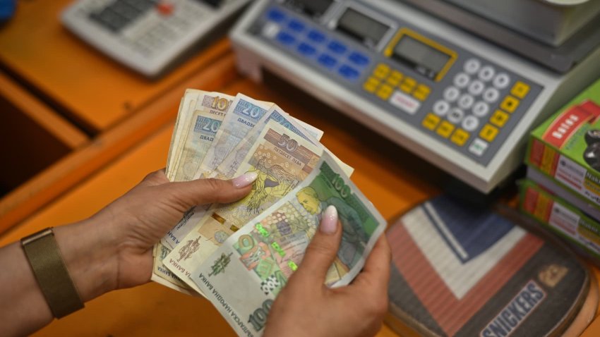 A worker counts Bulgarian Lev banknotes at a store in Sofia, Bulgaria, on Friday, March 29, 2024.