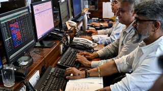 Stock traders monitor share prices during an intra-day trading session at a brokerage house in Mumbai on April 8, 2025. Asian and European markets battled on April 8 to recover from the previous day’s tariff-fuelled collapse. US President Donald Trump slapped a flat 26 percent tariff on imports from India last week, with New Delhi saying it was examining both “implications” and “opportunities” from the duty hikes. (Photo by Indranil MUKHERJEE / AFP) (Photo by INDRANIL MUKHERJEE/AFP via Getty Images)