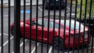 A Tesla vehicle is parked on West Executive Avenue near the White House and the Eisenhower Executive Office building in Washington, D.C., U.S., June 5, 2025.