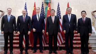 Delegations of China and the U.S. pose for a group photo prior to the first meeting of the China-U.S. economic and trade consultation mechanism in London, Britain, June 9, 2025.