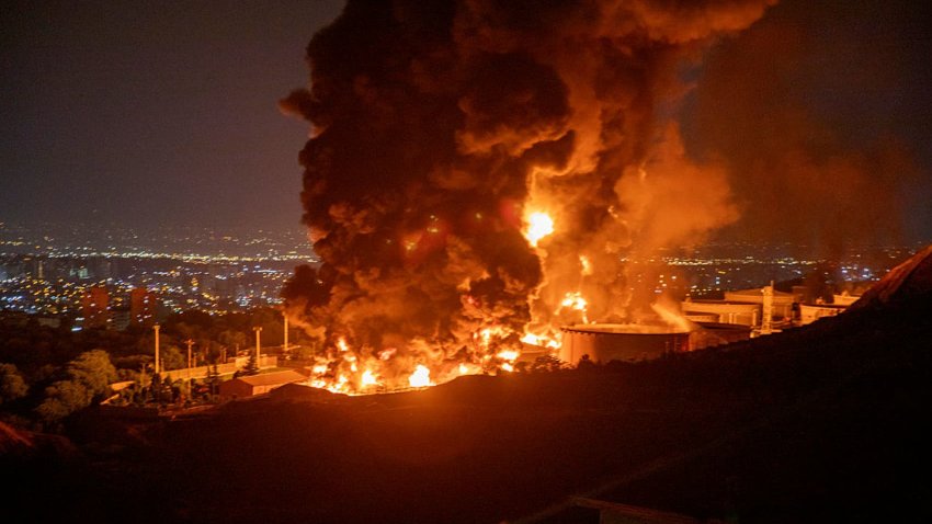 Fire and smoke rise into the sky after an Israeli attack on the Shahran oil depot on June 15, 2025 in Tehran, Iran.