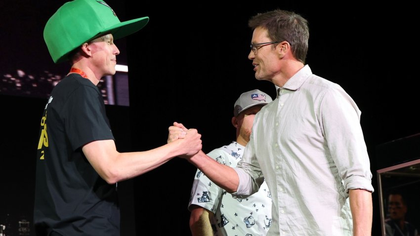 Man shakes hands with Tom Brady