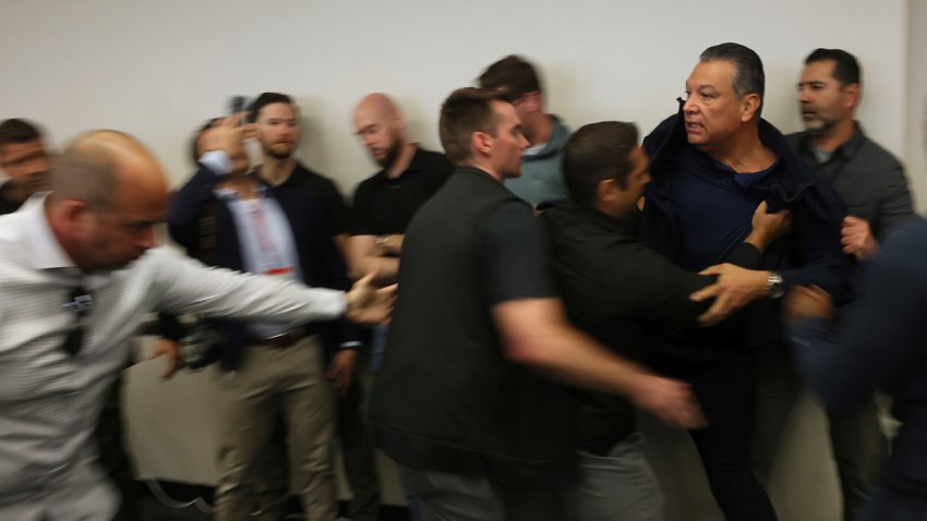 U.S. Sen. Alex Padilla is pushed out of the room as Homeland Security Secretary Kristi Noem holds a news conference regarding the recent protests in Los Angeles on Thursday, June 12, 2025.