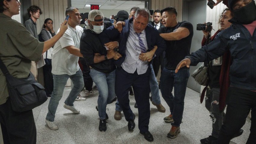 New York City Comptroller Brad Lander is placed under arrest by Immigration and Customs Enforcement (ICE) and FBI agents outside federal immigration court on Tuesday, June 17, 2025, in New York. (AP Photo/Olga Fedorova)