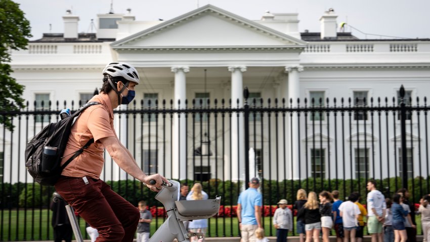 WASHINGTON, DC – JUNE 9: A man on a bike wears a face mask due to a code orange air quality alert due to smoke from Canadian wildfires on June 9, 2023 in Washington, DC. Compared to earlier in there week, the air quality is much improved on Friday in the Washington DC region and is forecasted to dissipate this weekend. (Photo by Drew Angerer/Getty Images)