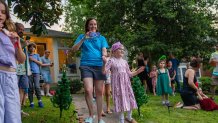 WASHINGTON, DC - JUNE 28: Kacey and her mother approach the parade in front of their home in Bethesda, Maryland, on June 28, 2025. (Photo by Allison Robbert/For The Washington Post via Getty Images)