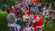 WASHINGTON, DC - JUNE 28: Neighbors gather in front of Kacey's home to see her and Santa in Bethesda, Maryland, on June 28, 2025. (Photo by Allison Robbert/For The Washington Post via Getty Images)