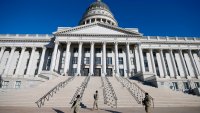 Utah National Guardsmen stand guard at the Utah State Capitol building to provide security in Salt Lake City, Utah on January 20, 2021.