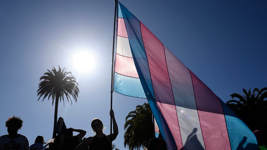 A marcher waves a transgender pride flag during the 21st annual Trans March on June 27, 2025 in San Francisco.