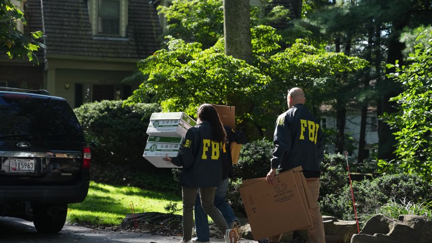 BETHESDA, MARYLAND – AUGUST 22: FBI agents work outside the home of John Bolton, former national security adviser to President Trump, August 22, 2025 in Bethesda, Maryland.  The FBI conducted an early morning court-authorized search of Bolton’s home.  (Photo by Andrew Harnik/Getty Images)