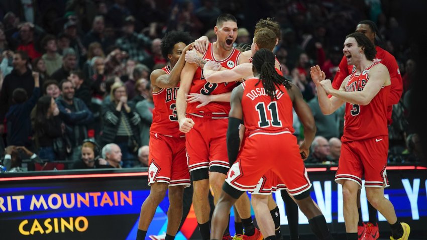Chicago Bulls center Nikola Vucevic (9) celebrates with teammates after the game winning buzzer beater three point basket against the Portland Trail Blazers at Moda Center.