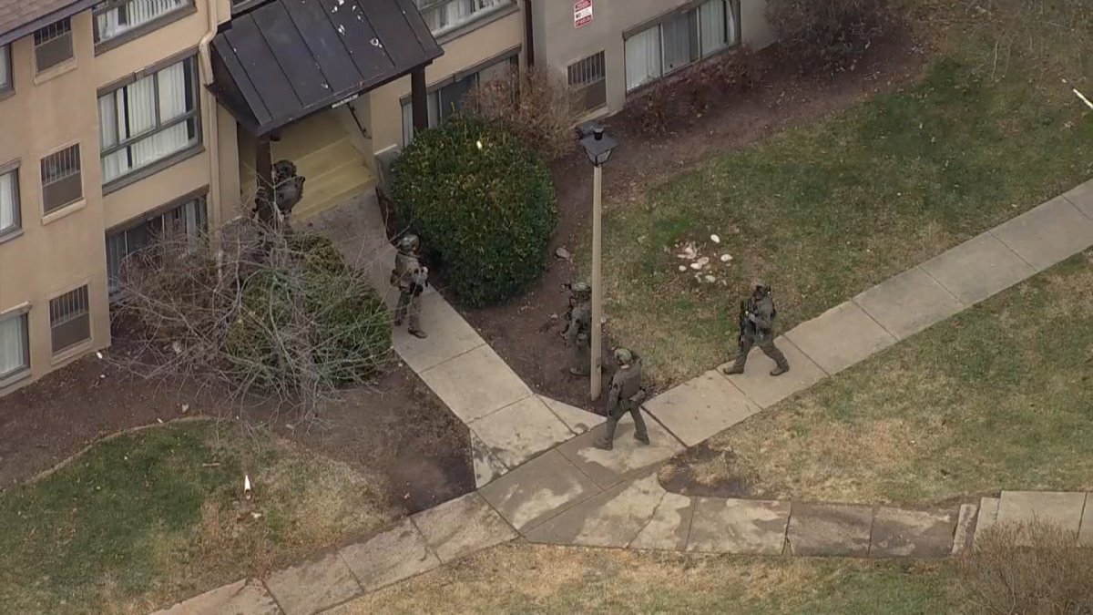 Schools on lockdown as police search for suspect who shot, killed man ...