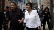 WASHINGTON, DC - AUGUST 22:  Civil rights activist Jesse Jackson (L), accompanied by Washington Mayor Muriel Bowser (R), attends the 60th birthday block party for area landmark Ben's Chili Bowl August 22, 2018 in Washington, DC. Ben's Chili Bowl was opened in 1958 by Virginia Ali and her husband Ben. Ben's original location is a neighborhood staple where such luminaries as Ella Fitzgerald, Nat King Cole, Martin Luther King, Jr., and former President Barack Obama have eaten. (Photo by Win McNamee/Getty Images)
