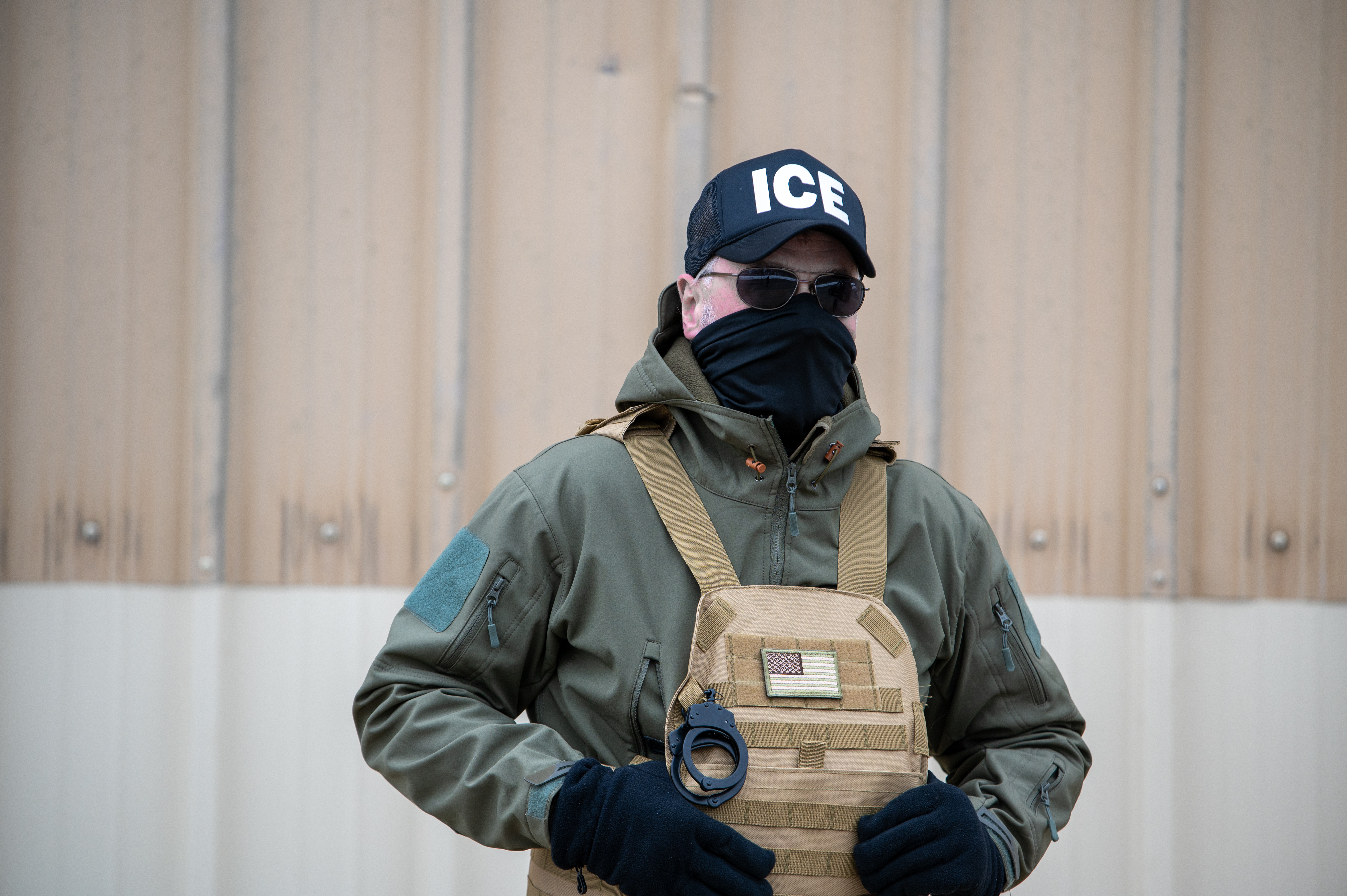 DOJ challenges Virginia laws restricting officer face coverings, ICE agreements
