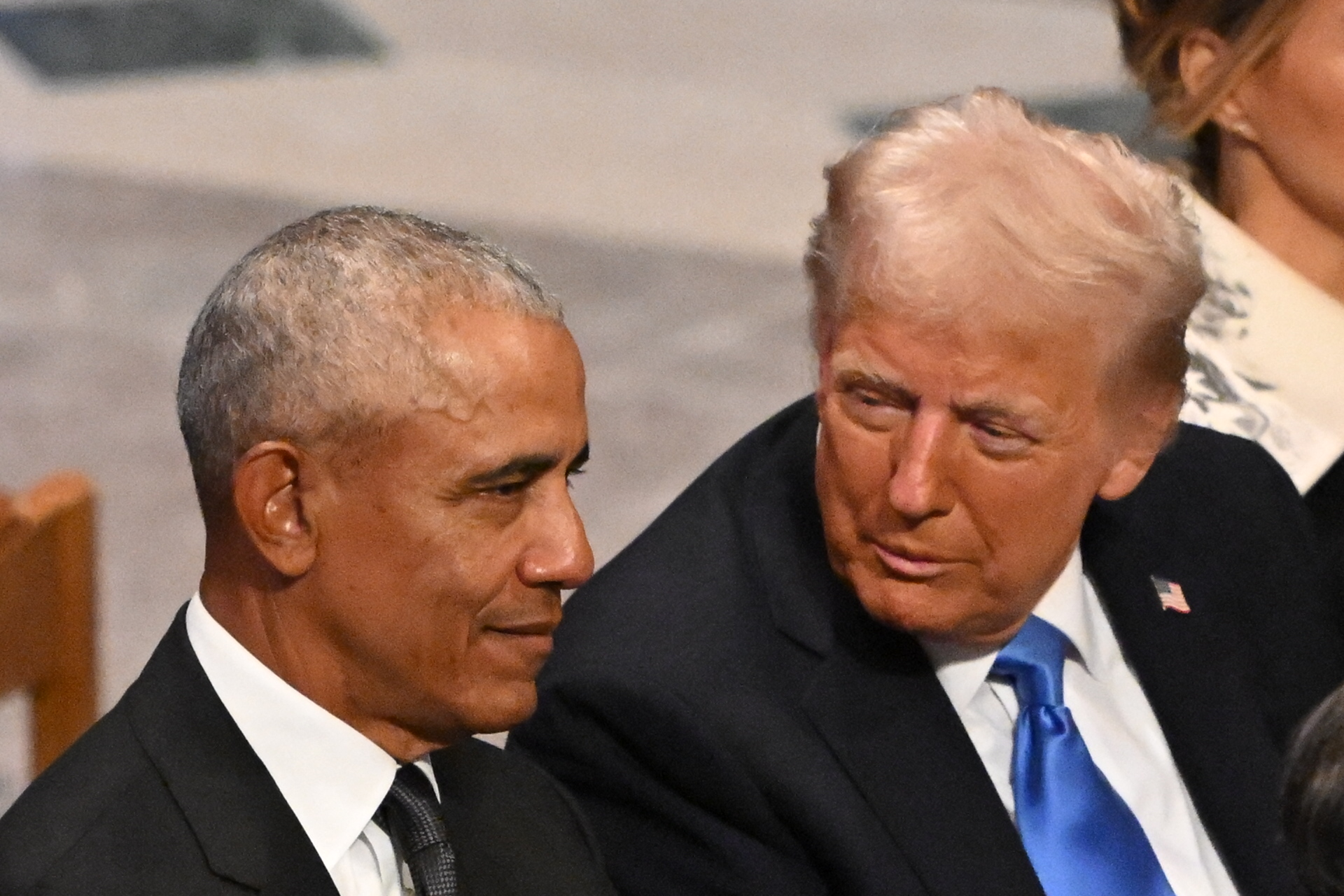Trump posts doctored photo of Obamas and Air Force One with graffiti on plane