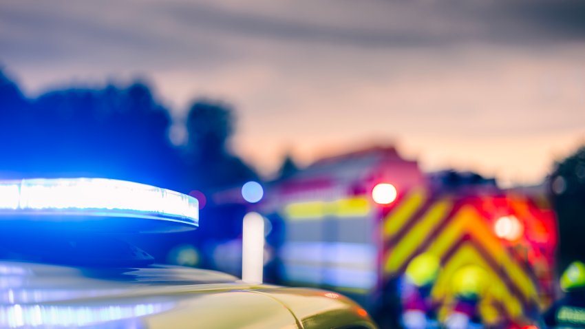 Selective focus on blue flashing light on ambulance car of emergency medical service. Warning symbol on road against traffic accident.