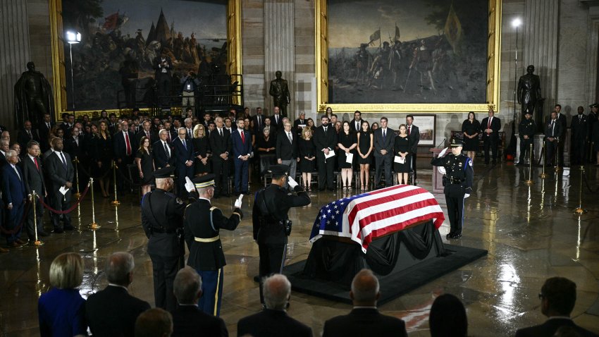 A military honor guard salutes during a Congressional tribute to late US Senator Lindsey Graham at the US Capitol in Washington, DC, on July 28, 2026. Graham, a South Carolina Republican and key Trump ally who was elected to the Senate four times, died at age 71 on July 11. (Photo by Brendan SMIALOWSKI / AFP via Getty Images)