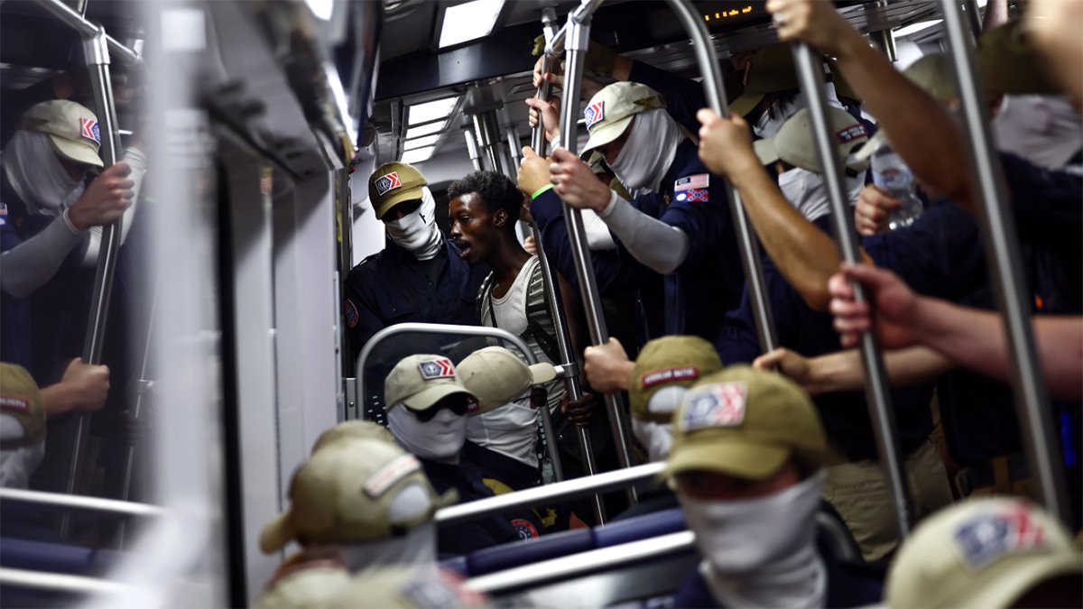 Who are the masked men who marched in DC with Confederate flags?