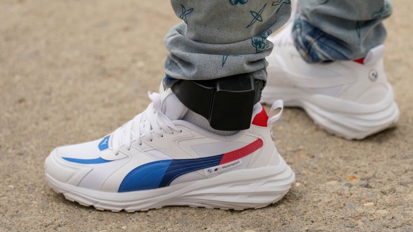 A Haitian resident of Columbus, Ohio, departs the ICE Enforcement and Removal Operations field office with an ankle m...