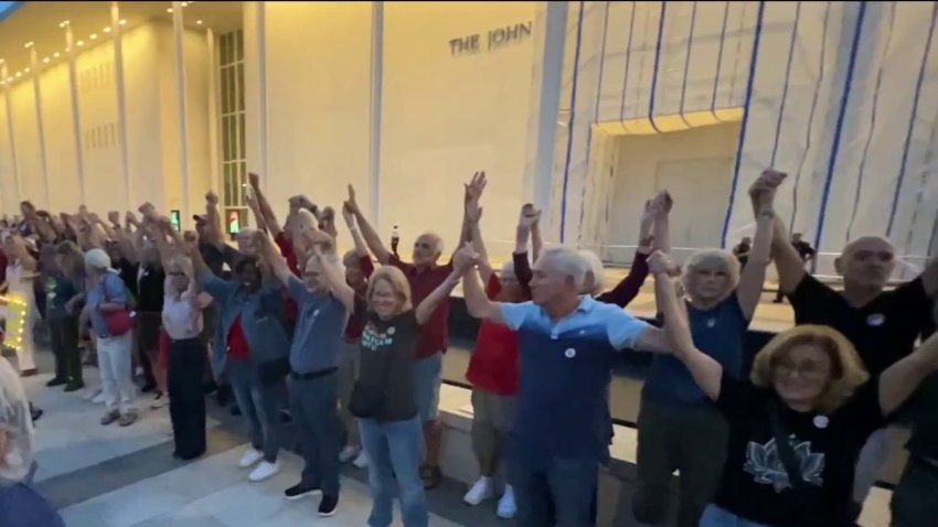 Protesters form a human chain outside the Kennedy Center Sept. 18, 2026.