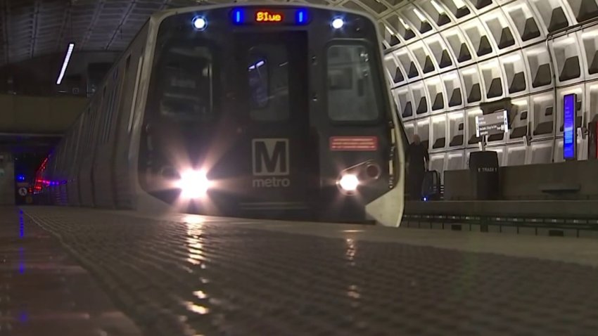 Metro train pulls into a station
